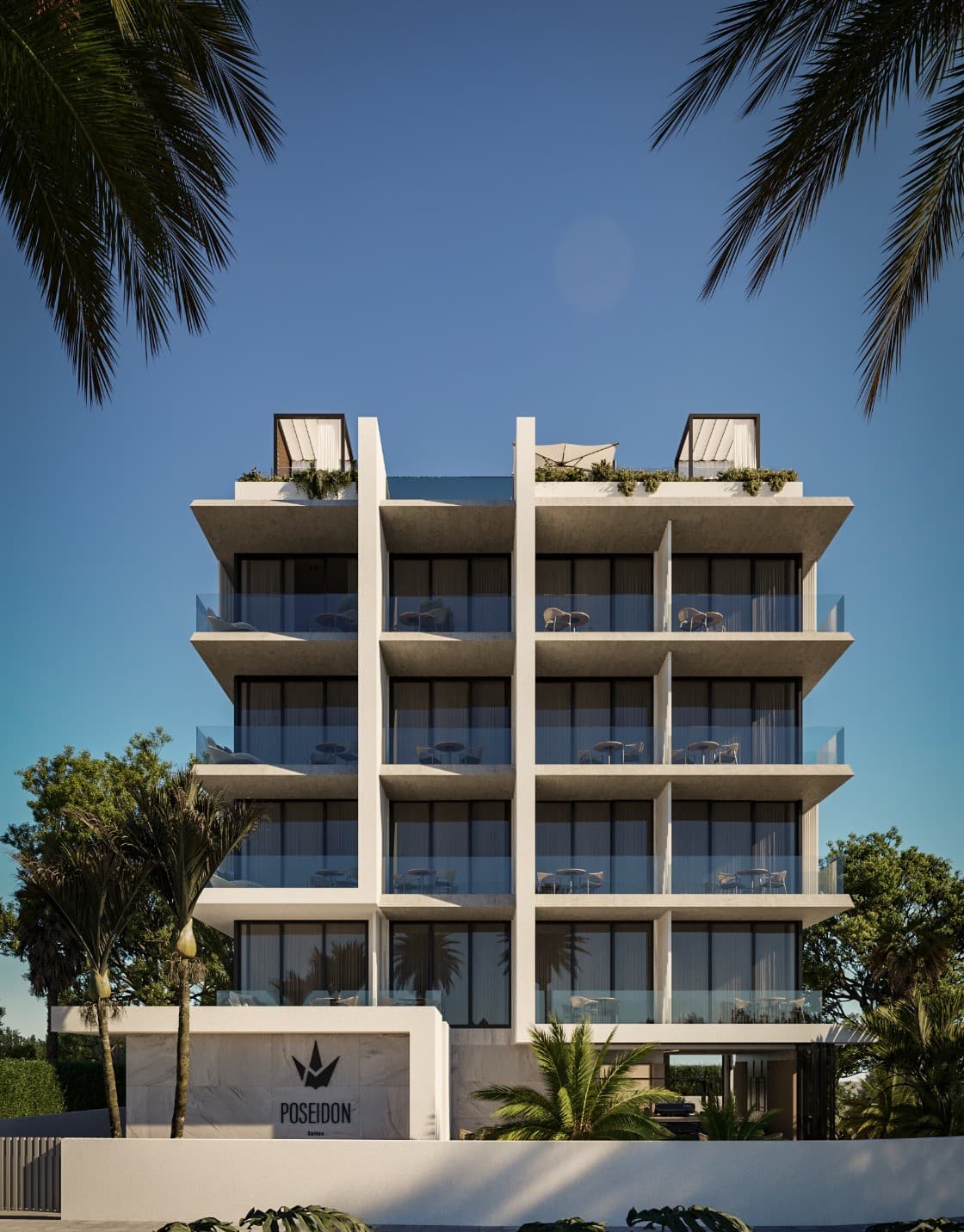 Poseidon Suites building exterior with palm trees and clear blue sky